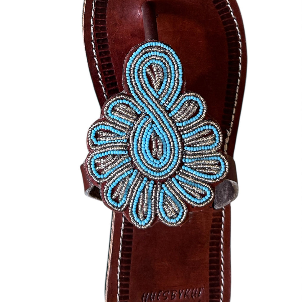 Close up of Maasai hand beaded leather sandal detail