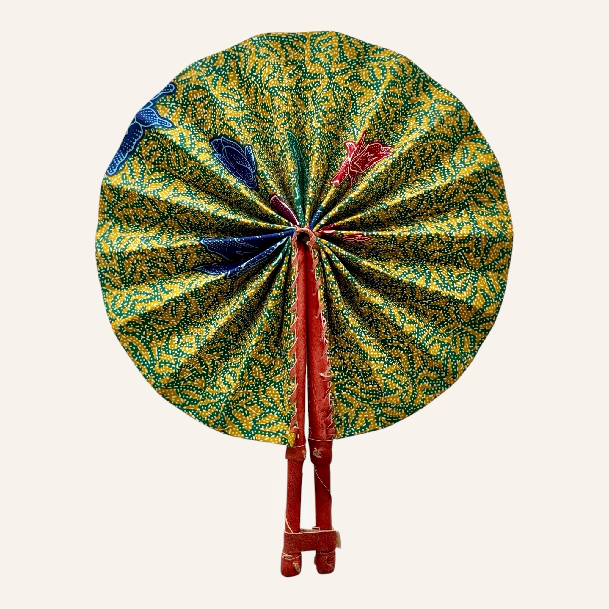 Hues by Kui traditional folding fan with yellow, green, and blue batik fabric and durable leather handles.