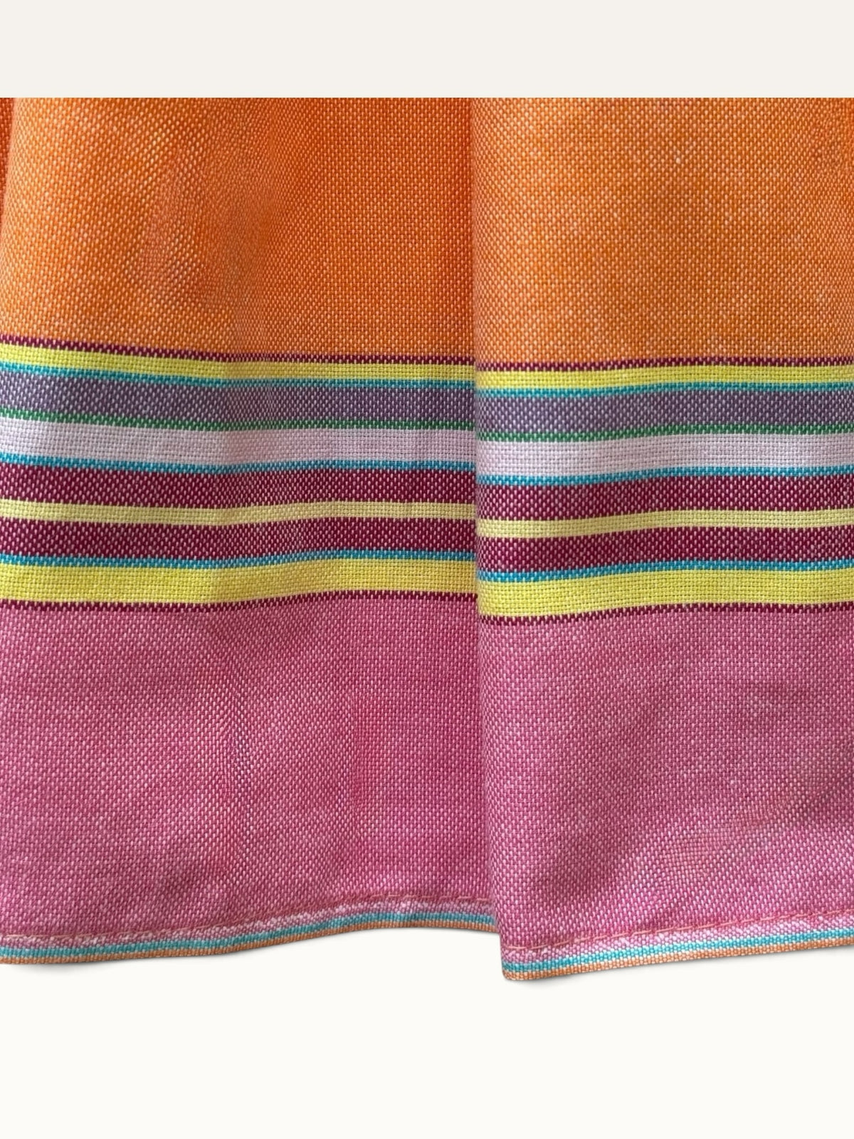 Hues by Kui coral midi dress featuring a vibrant multi-coloured striped trim on the hem and textured fabric