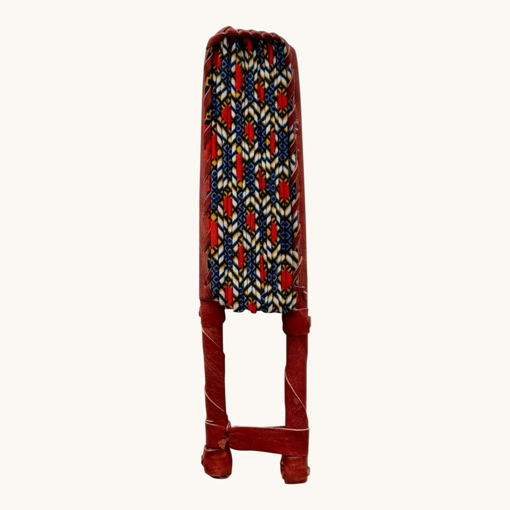 Hues by Kui handcrafted folding fan with vibrant African-inspired fabric and a premium red leather handle.