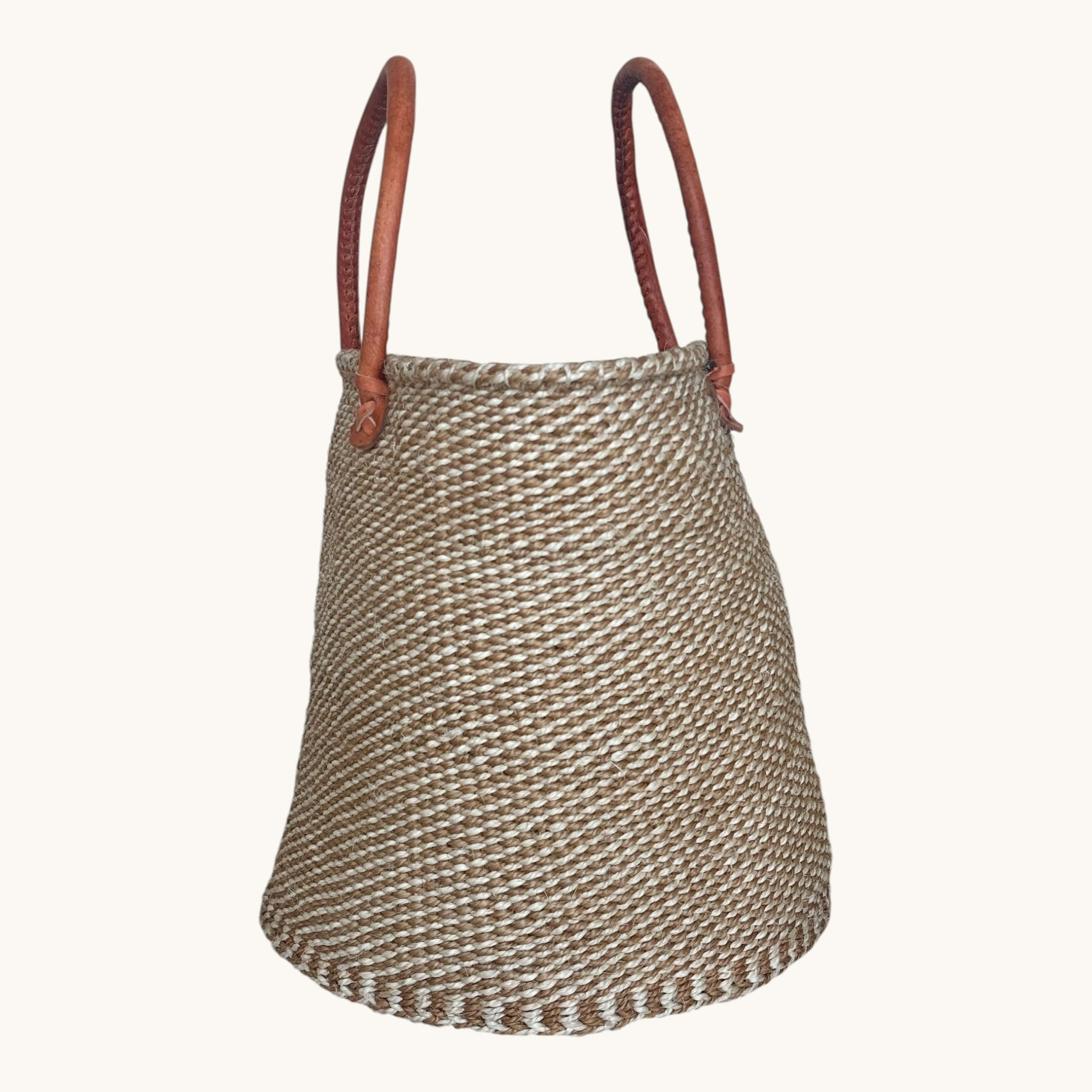 Hues by Kui handwoven natural fibre tote bag with rich brown leather handles and a textured bohemian design.