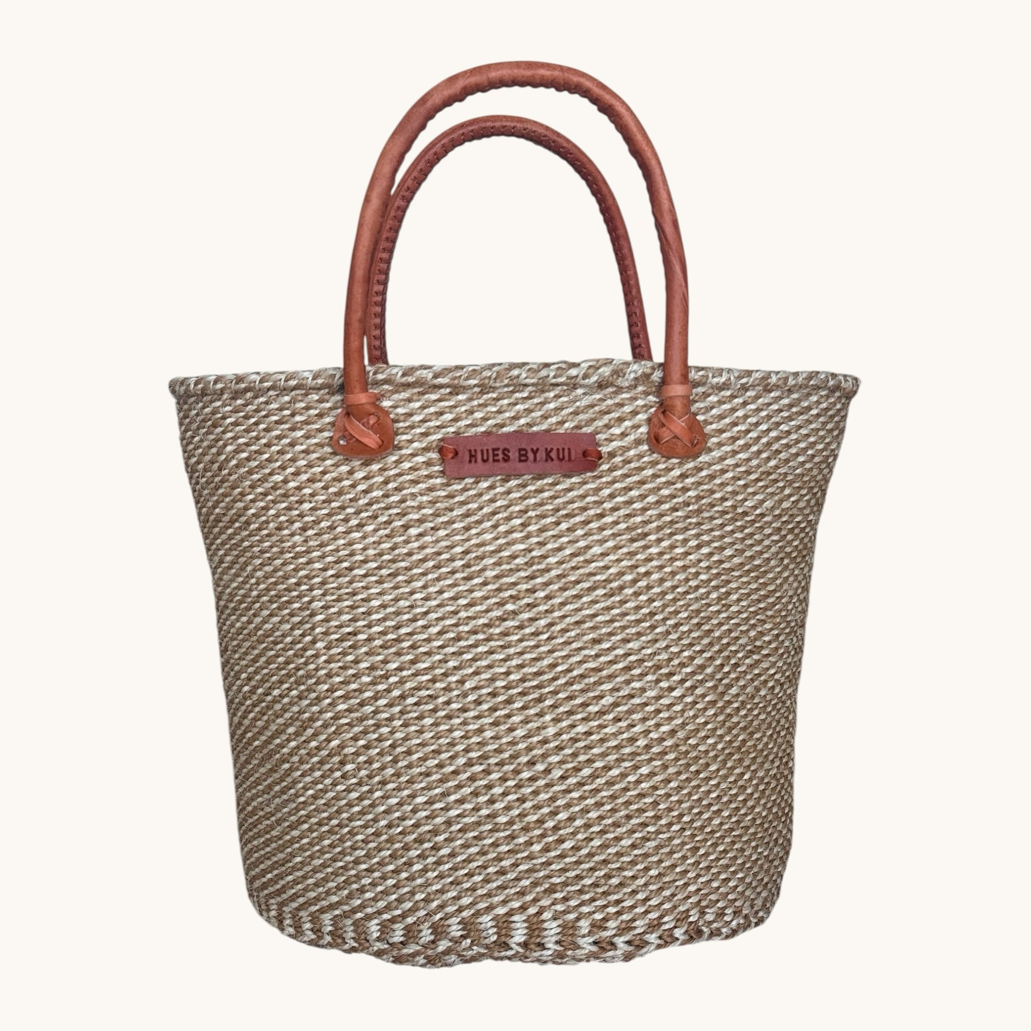 Hues by Kui handwoven natural fibre tote bag with brown leather handles and signature logo patch
