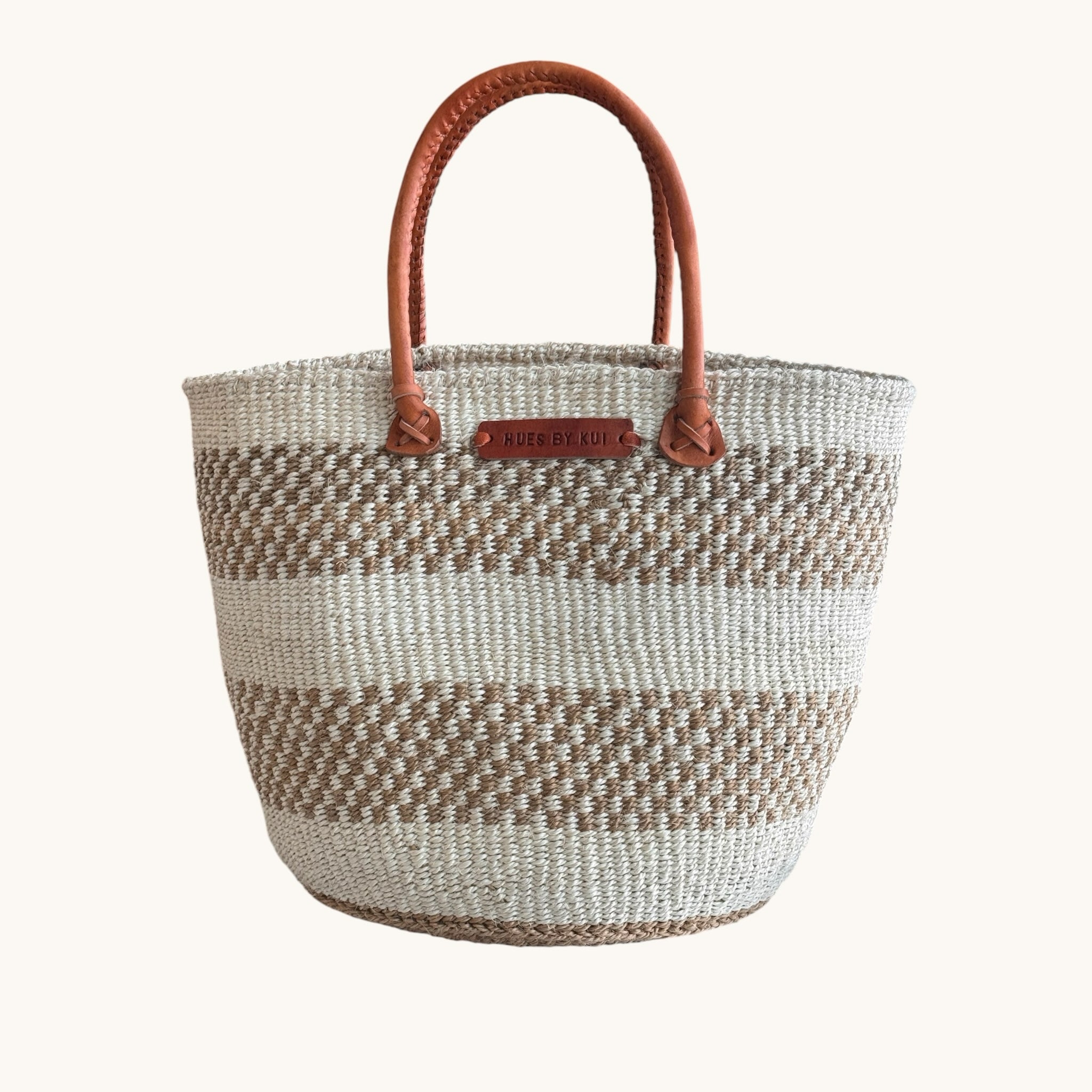 Hues by Kui handwoven tote bag with neutral striped natural fibres and premium tan leather handles.
