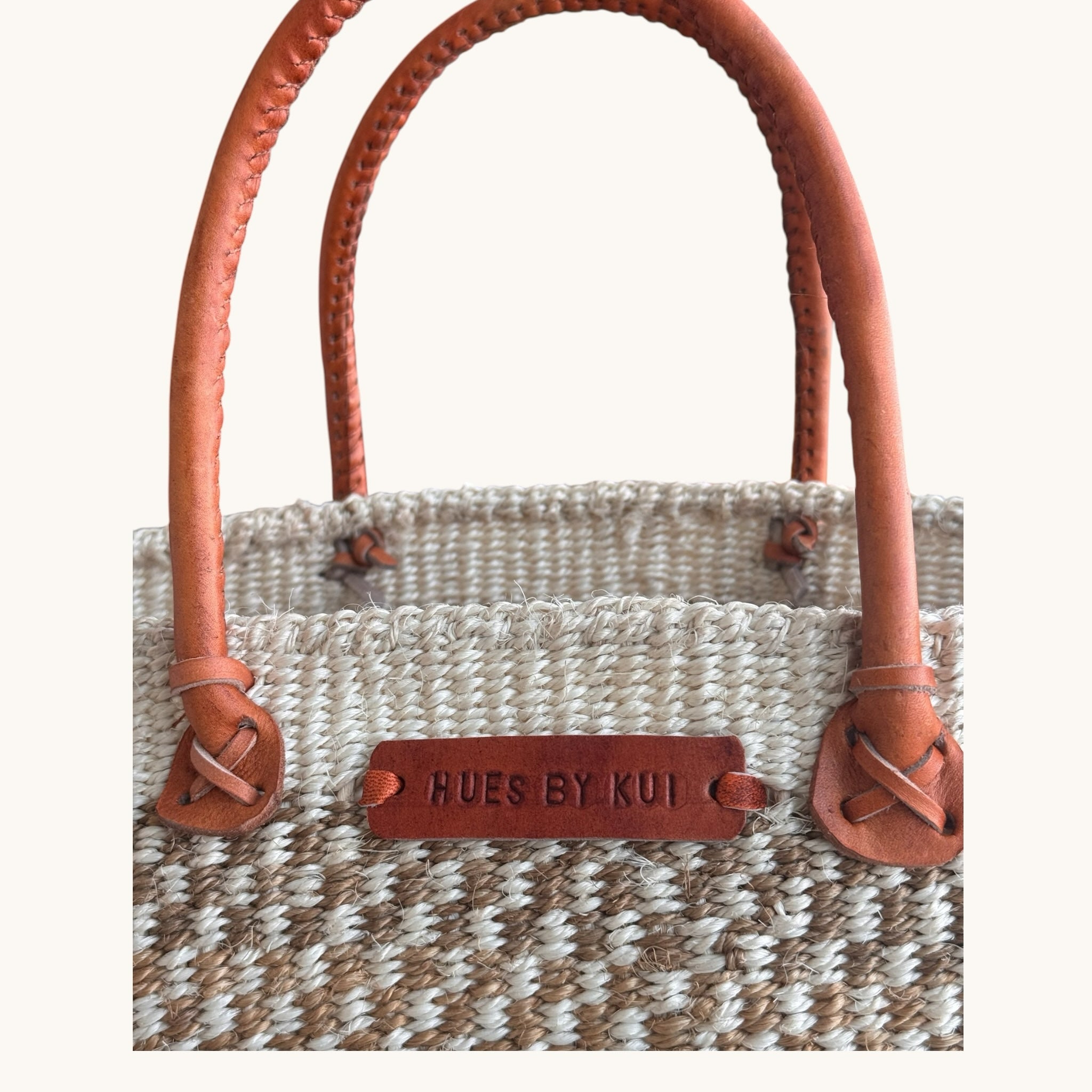 Hues by Kui handwoven tote bag in neutral striped fibres with premium tan leather handles and branded leather patch.