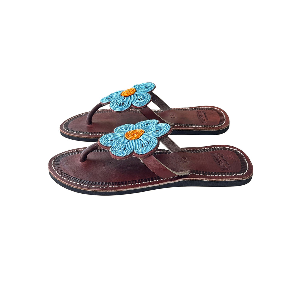 Side view of Maua Maasai leather sandals with blue beadwork