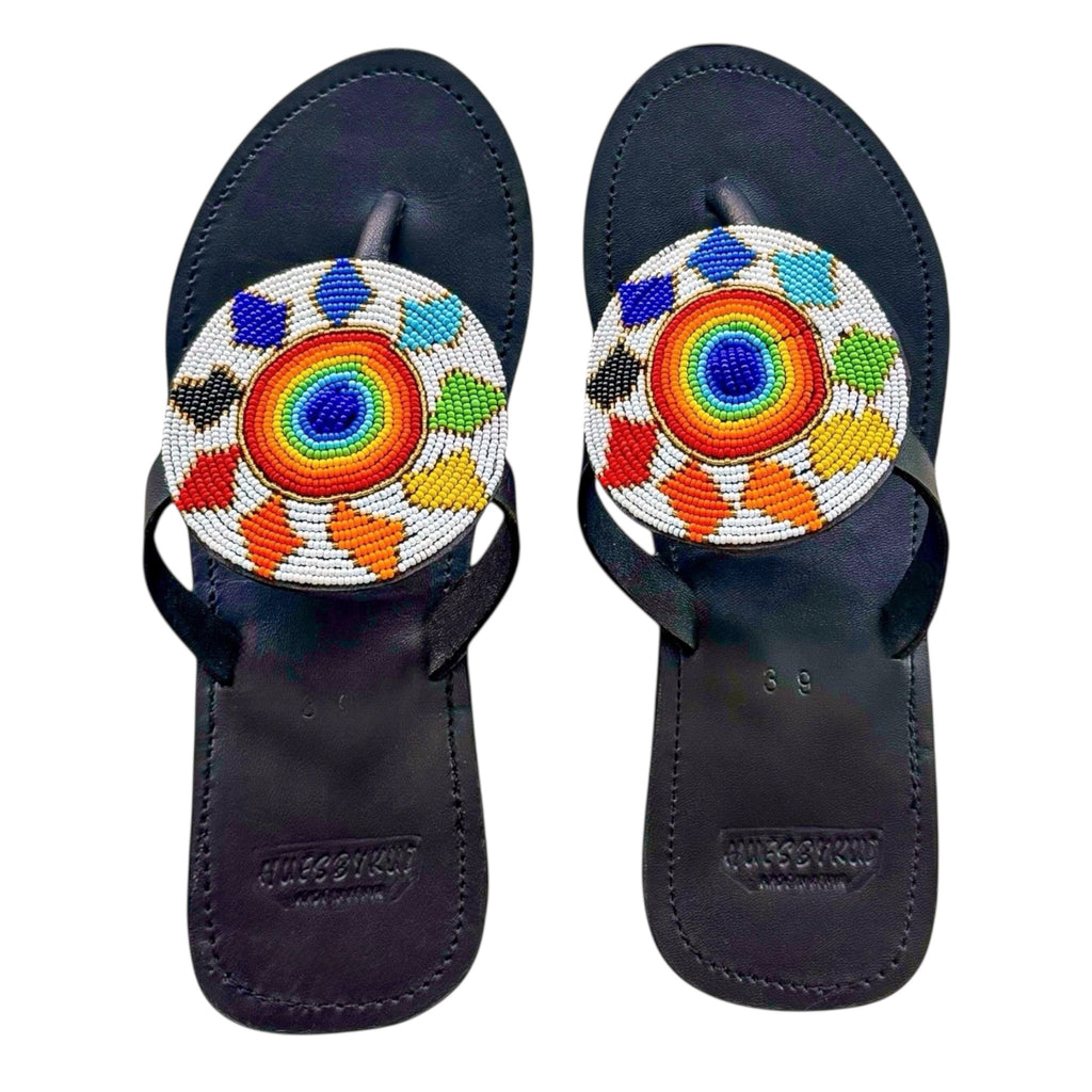Samawati handmade black leather sandals with circular rainbow beadwork by Hues by kui