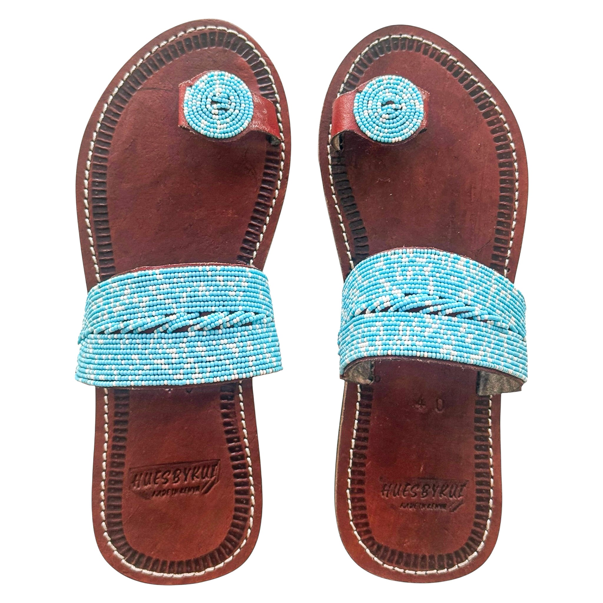 Tulia beaded leather sandals featuring soft turquoise beadwork on genuine brown leather
