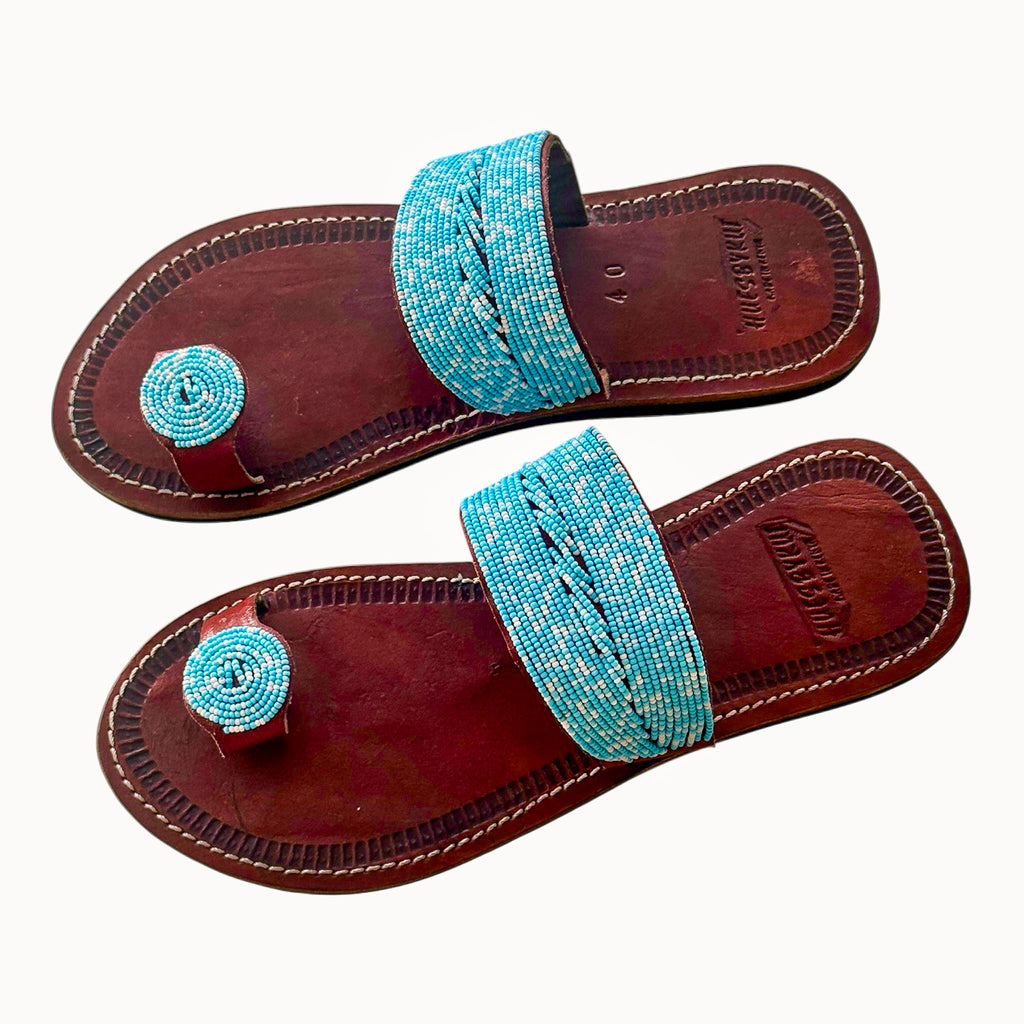 Tulia beaded leather sandals featuring soft turquoise beadwork on genuine brown leather
